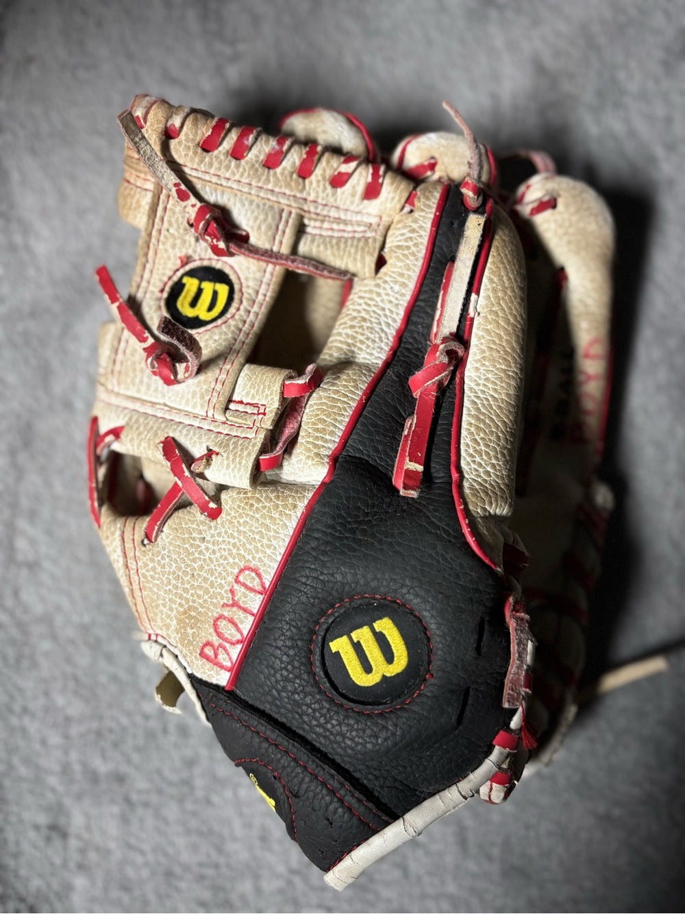 Wilson Black and Cream Baseball Glove with Red Lacing